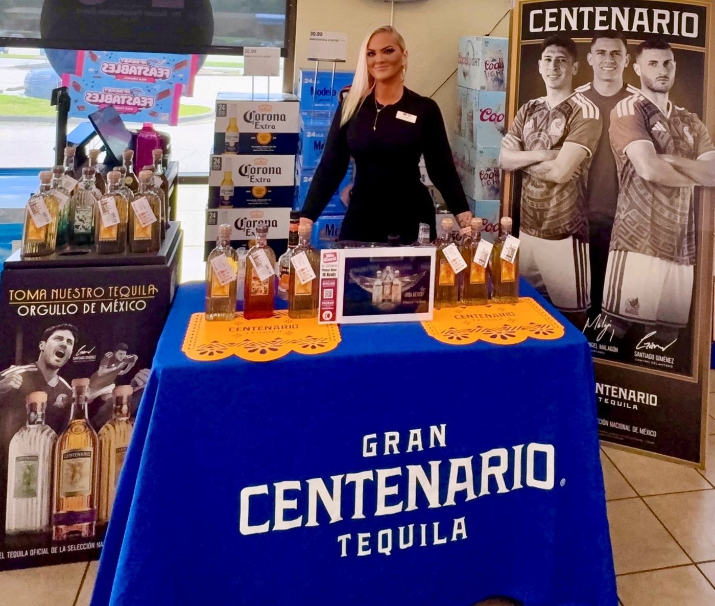 MSS associate at a Gran Centenario Tequila display with Corona and Coors Light end caps